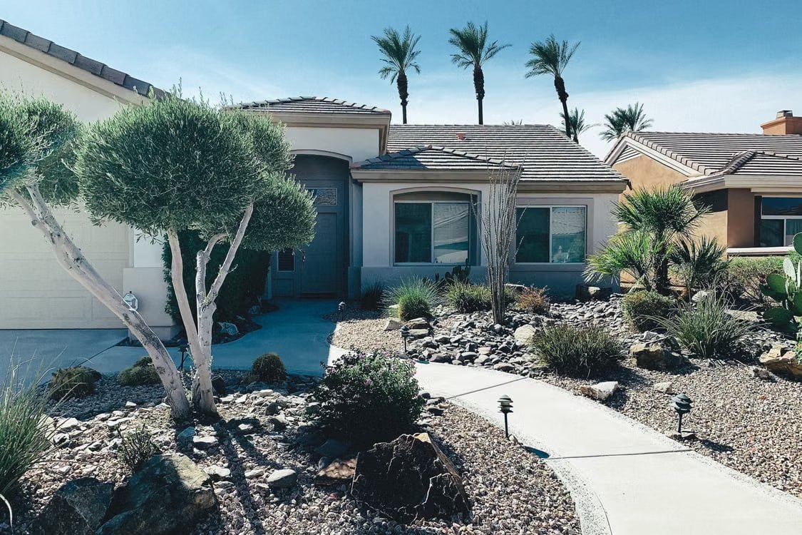 Desert-style home exterior with landscaped front yard